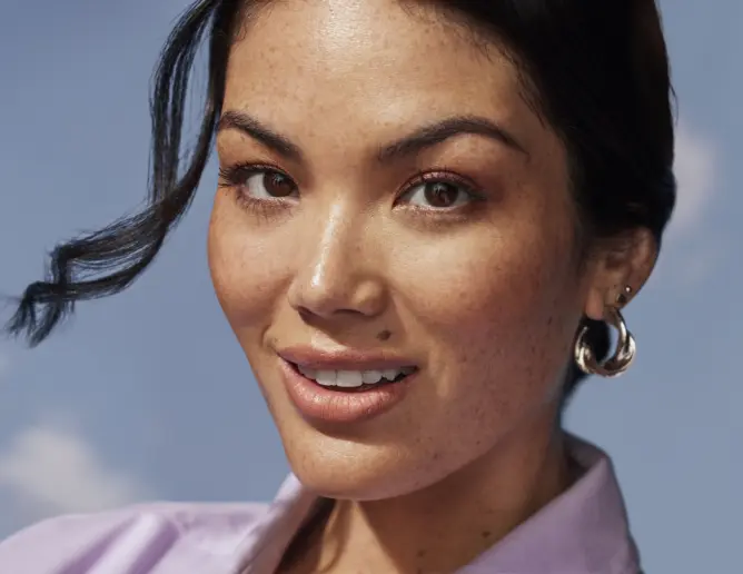 Close up of a smiling woman with earings