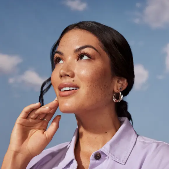 Smiling woamn wearing earrings