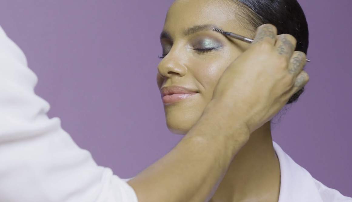 Close up of a woman having her makeup done