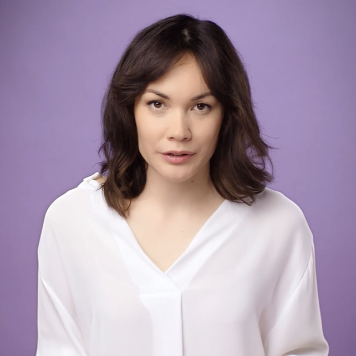 Woman with brown hair in a white shirt